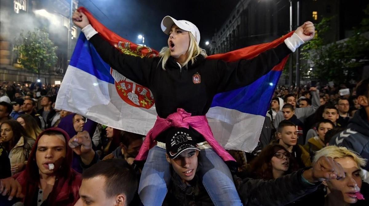 undefined37951278 topshot   a protester waves the serbian flag during a protes170407163600