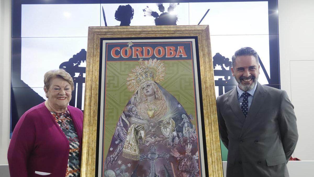 La presidenta de la Agrupación de Cofradías, Olga Caballero, y el pintor sevillano José Cabrera Lasso de la Vega, autor del cartel.
