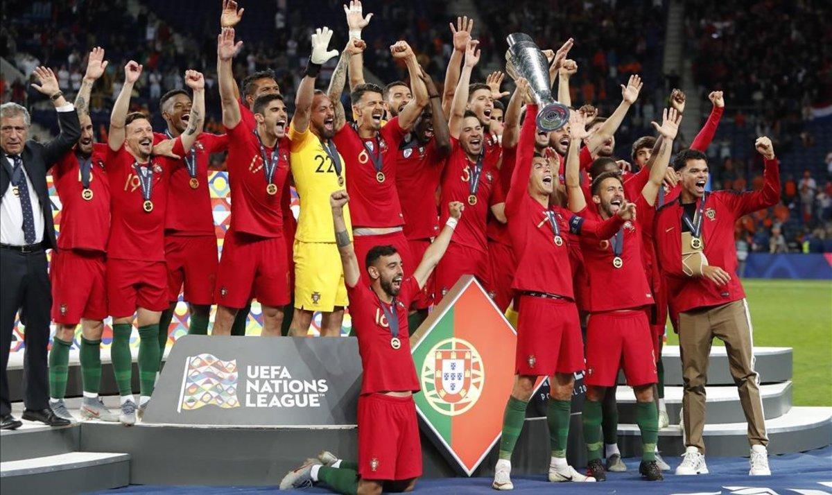 jdomenech48565779 portugal players celebrate with their trophy after defeating190609231129