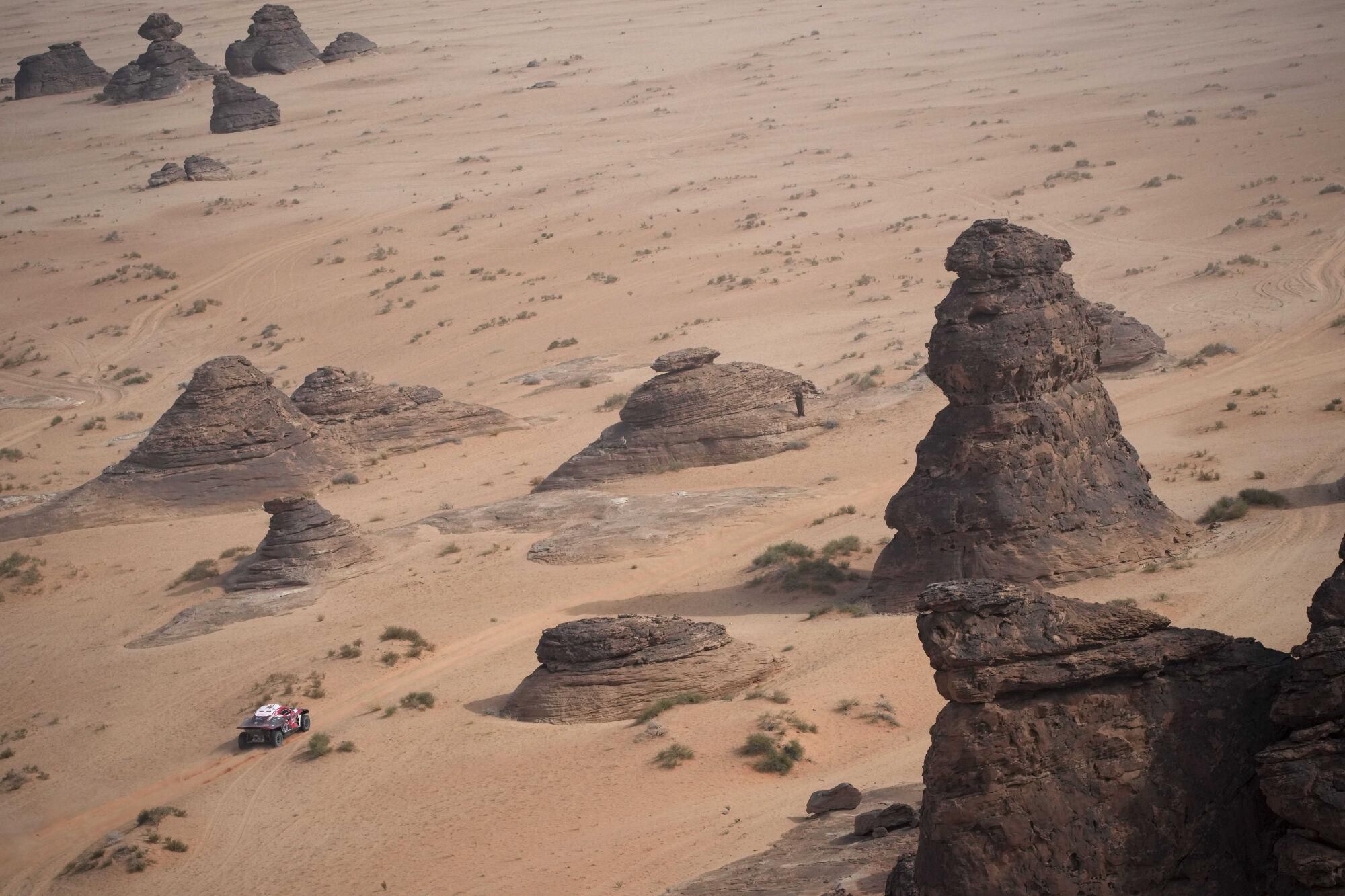 A car drives during the fifth stage of the Dakar Rally between Alula and Hail, Saudi Arabia, Thursday, Jan. 9, 2025. (AP Photo/Christophe Ena). EDITORIAL USE ONLY / ONLY ITALY AND SPAIN