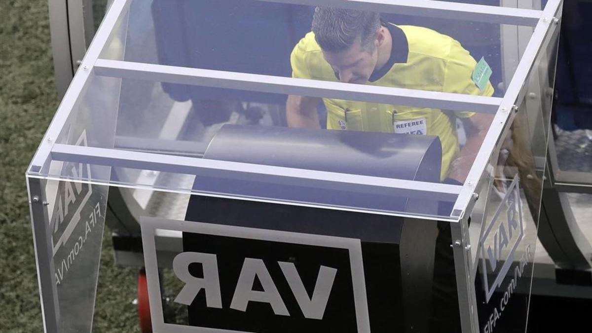 Matt Conger from New Zealand watches the Video Assistant Referee system  known as VAR during the group D match between Nigeria and Iceland at the 2018 soccer World Cup in the Volgograd Arena