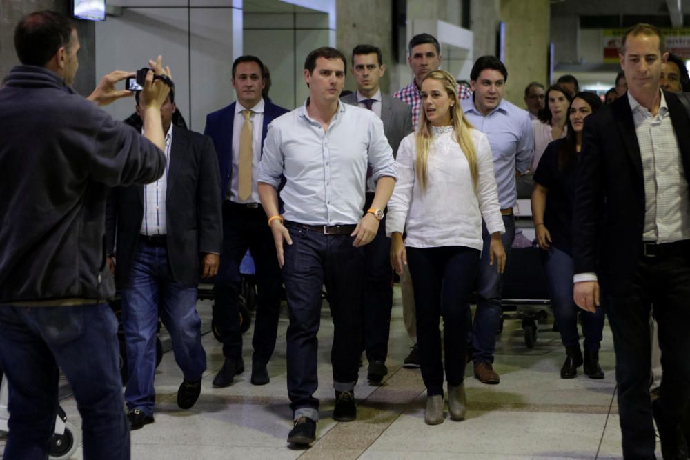 Ciudadanos party leader Rivera walks next to ...