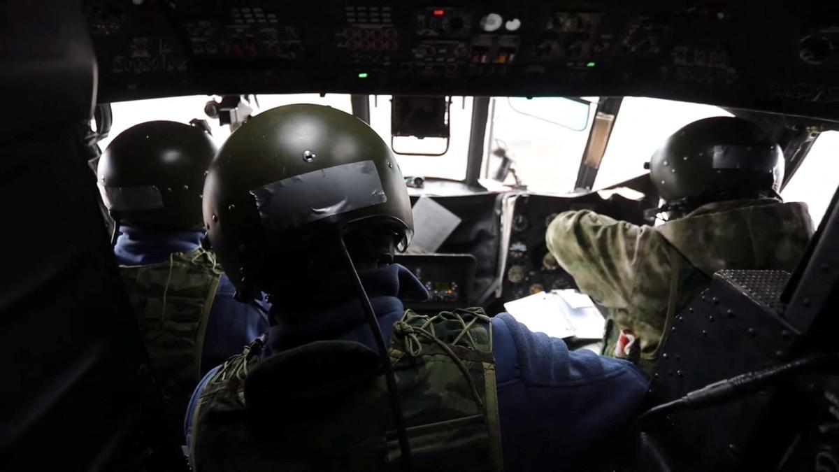 View of inside a Russian Army aviation helicopter as it escorts units of Russian Armed Forces in Ukraine, during their invasion, at in unspecified location in this screengrab obtained from social media, March 2, 2022. Russian Defence Ministry/Handout via REUTERS