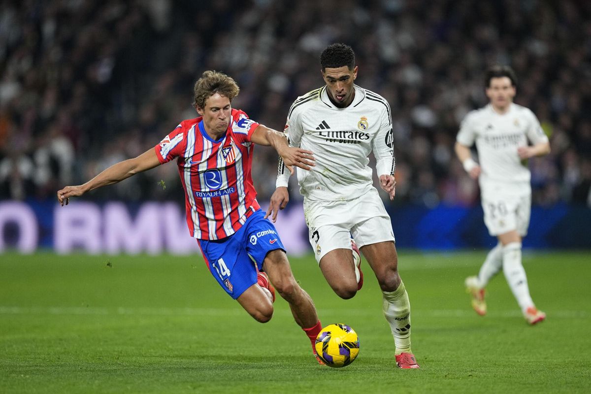 Jude Bellingham of Real Madrid and Marcos Llorente of Atletico de Madrid in action during the Spanish League, LaLiga EA Sports, football match played between Real Madrid and Atletico de Madrid at Santiago Bernabeu stadium on February 8, 2025, in Madrid, Spain. AFP7 08/02/2025 ONLY FOR USE IN SPAIN. Oscar J. Barroso / AFP7 / Europa Press;2025;SOCCER;SPAIN;SPORT;ZSOCCER;ZSPORT;Real Madrid v Atletico de Madrid - LaLiga EA Sports;