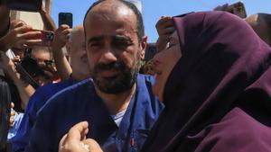 Al-Shifa hospital director Mohammed Abu Salmiya who was detained by Israeli forces since November, is welcomed by relatives after his release alongside other detainees, at Nasser hopsital in Khan Yunis in the southern Gaza Strip July 1, 2024, amid the ongoing conflict between Israel and the Palestinian Hamas militant group. (Photo by Bashar TALEB / AFP)