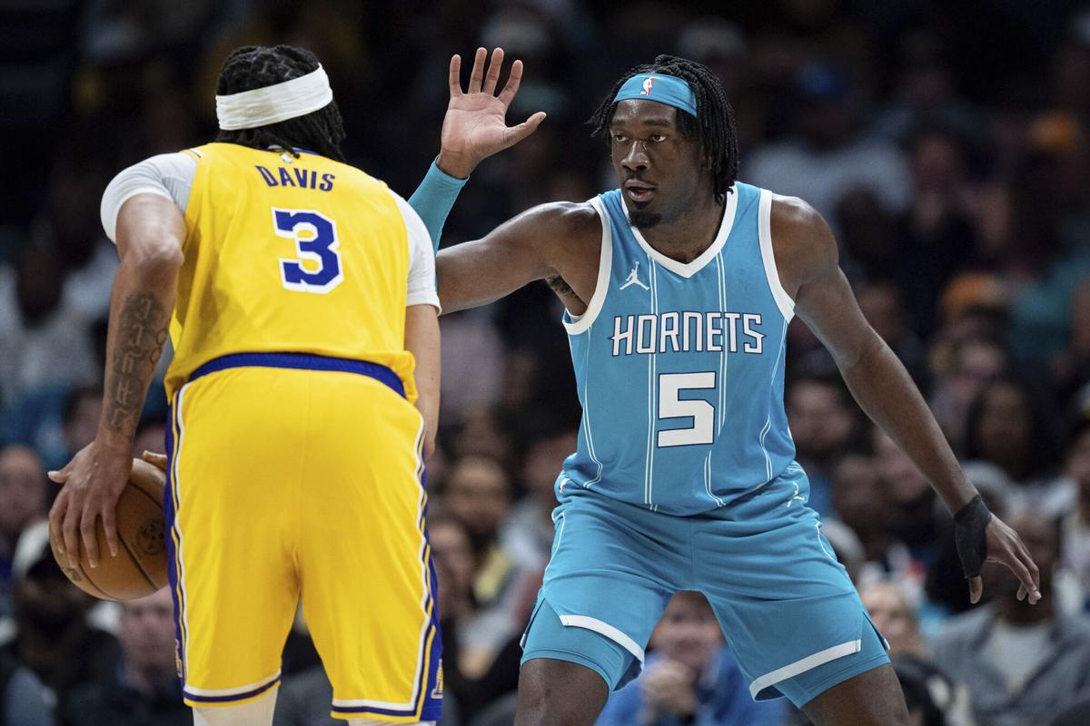 Charlotte Hornets center Mark Williams (5) guards Los Angeles Lakers forward Anthony Davis (3) during the first half of an NBA basketball game Monday, Jan. 27, 2025, in Charlotte, N.C. (AP Photo/Jacob Kupferman)