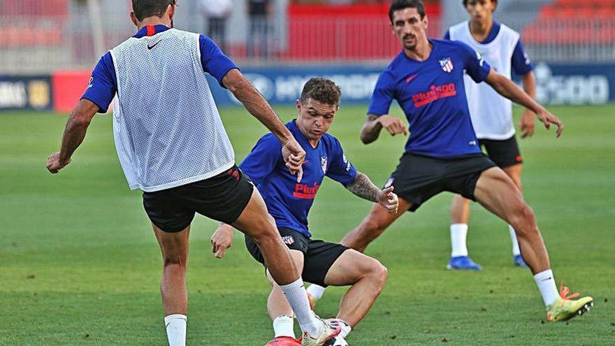 Los jugadores del Atlético, durante el entrenamiento de ayer.