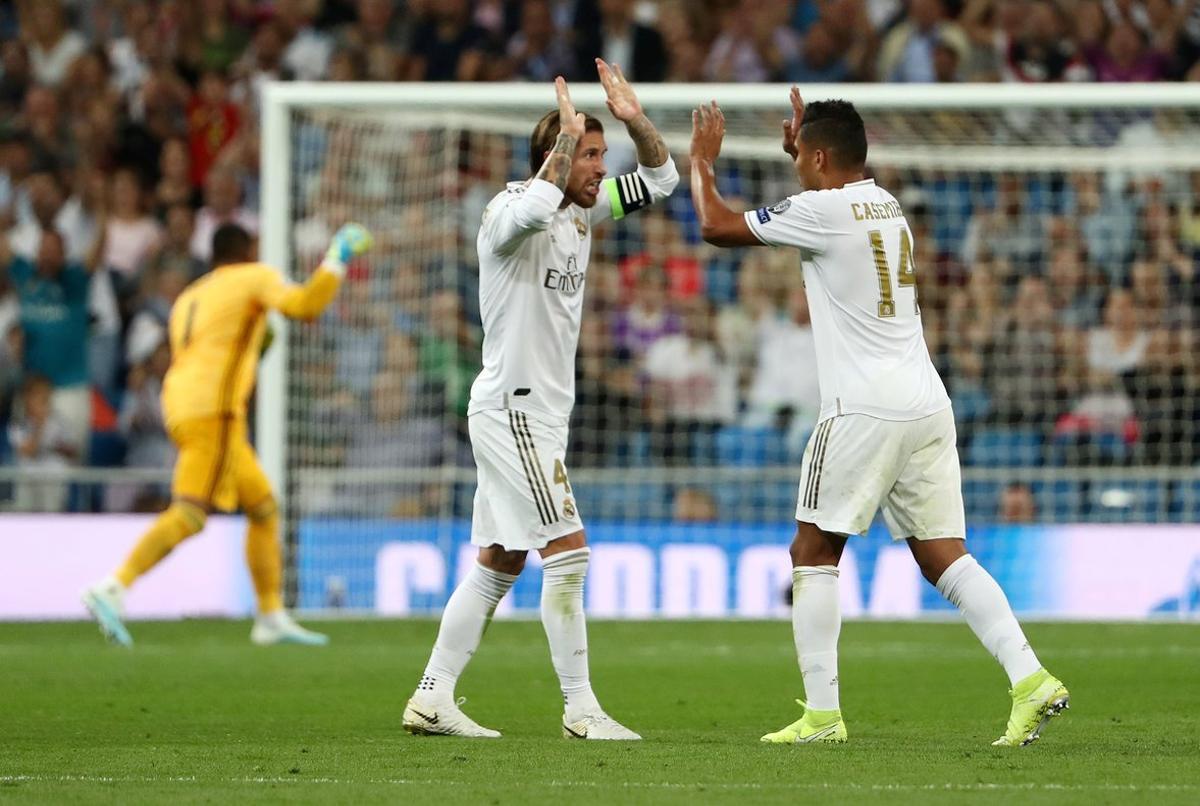 Soccer Football - Group A - Real Madrid v Club Brugge - Santiago Bernabeu, Madrid, Spain - October 1, 2019  Real Madrid’s Sergio Ramos celebrates scoring their first goal with Casemiro   REUTERS/Jon Nazca