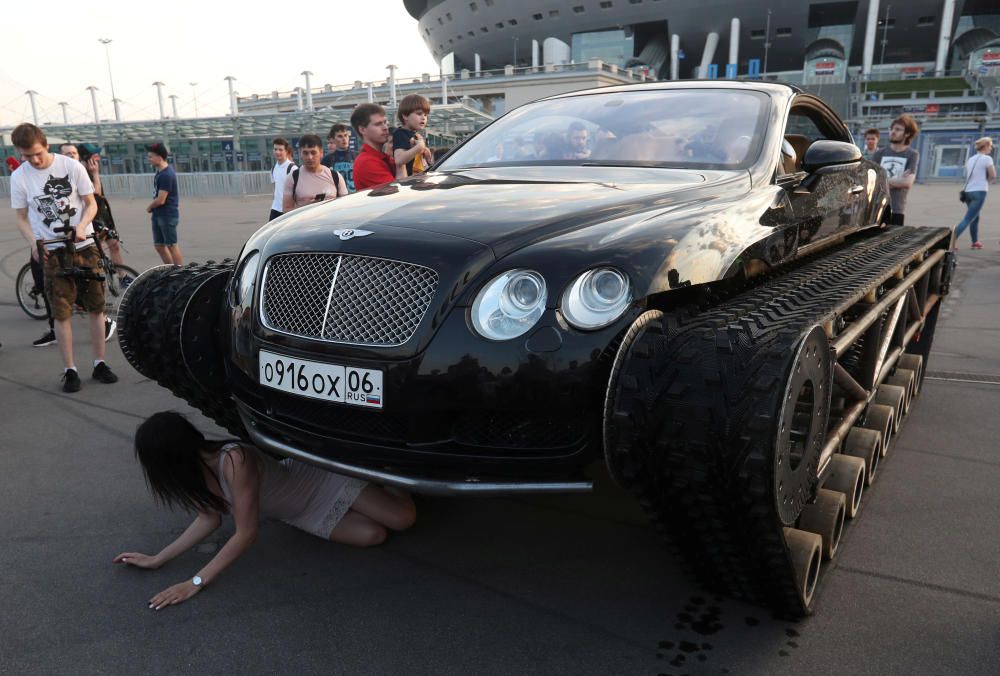 A woman poses for a picture next to a ...