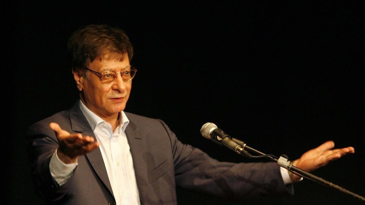 HAIFA  ISRAEL - JULY 15   Palestinian poet and journalist Mahmoud Darwish reads during his poetry show July 15  2007 in Haifa  Israel  Darwish  seen as a symbol of Palestinian nationalism  made his first appearance in Israel on Sunday since his self-imposed exile from Israel  where he lived until 1971   (Photo by Gil Cohen Magen-Pool Getty Images)