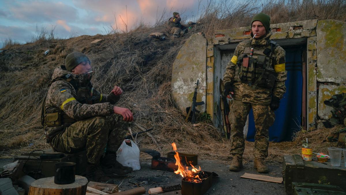Ukrainian servicemen are seen at fighting positions at the military airbase Vasylkiv in the Kyiv region