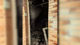 Un incendio obliga a desalojar un bloque de viviendas en Gijón