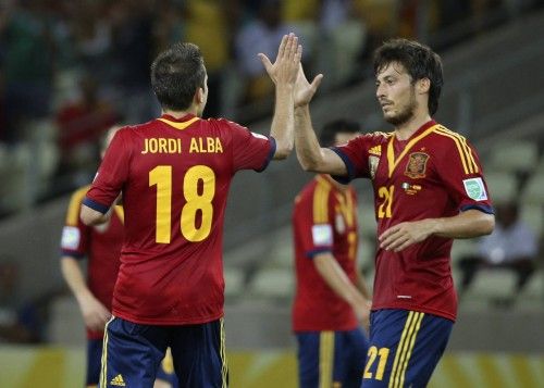 Spain's Alba celebrates with his teammate Silva after scoring a goal during their Confederations Cup Group B soccer match against Nigeria at the Estadio Castelao in Fortaleza