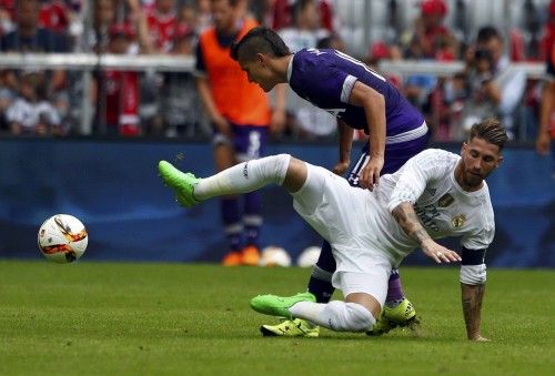 RReal Madrid's Ramos fights for tha ball with Tottenham Hotspur's Lamela during their pre-season Audi Cup tournament soccer match in Munich