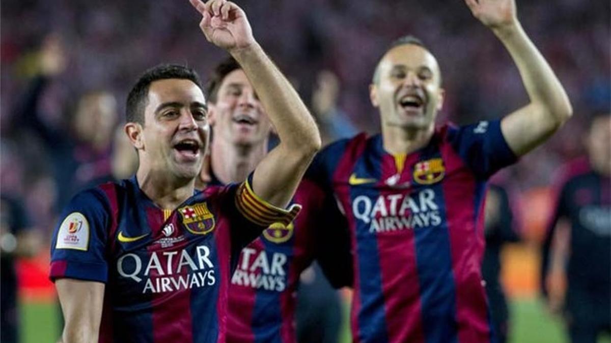 Xavi, Iniesta y Messi, tras la final de Copa