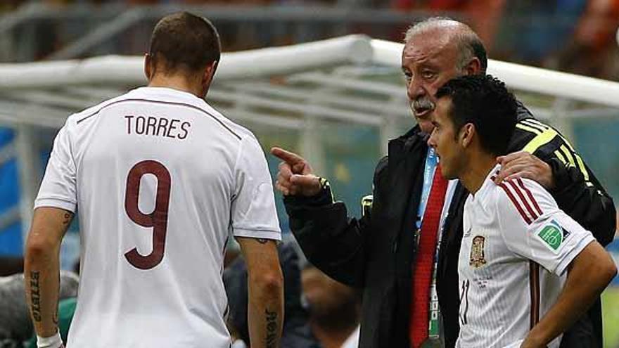 Vicente del Bosque, junto a Torres y Pedro