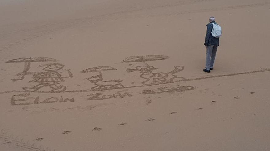Hace un dibujo en la arena de playa para 