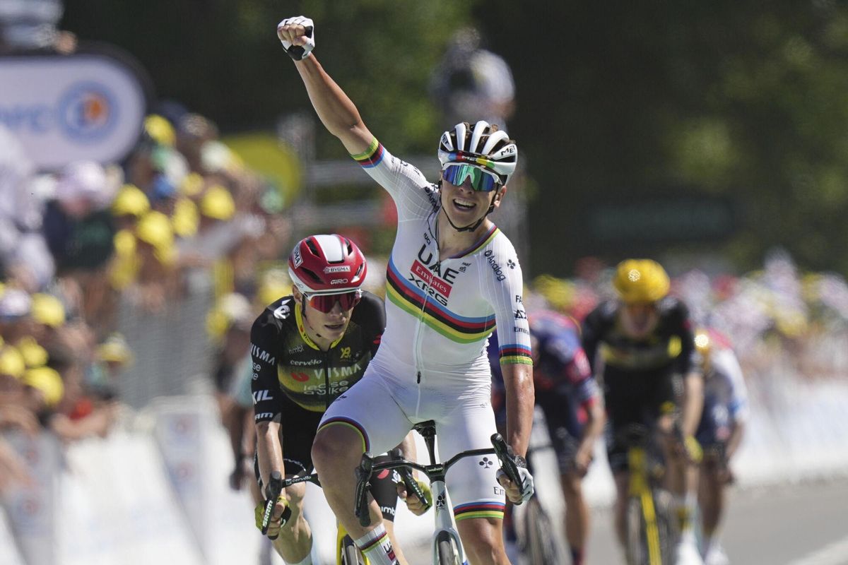 Slovenias Tadej Pogacar celebrates as he crosses the finish line to win the seventh stage of the Tour de France cycling race over 197 kilometers (122.4 miles) with start in Saint-Malo and finish in Mur-de-Bretagne Guerledan, France, Friday, July 11, 2025. (AP Photo/Thibault Camus). EDITORIAL USE ONLY/ONLY ITALY AND SPAIN