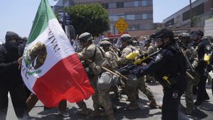 Protesters clash with authorities in downtown Los Angeles, Sunday, June 8, 2025, following last nights immigration raid protest