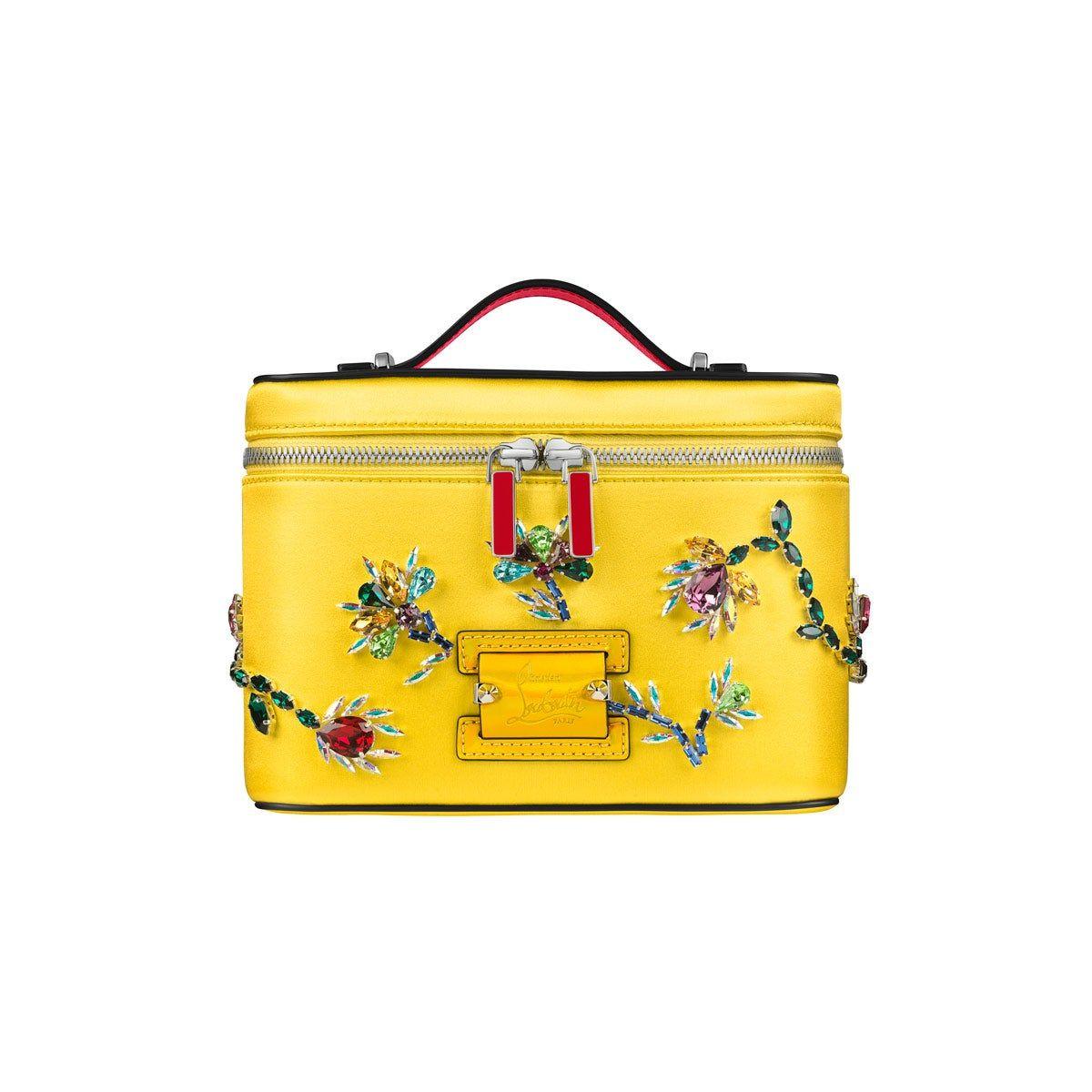 Bolso de mano amarillo con joyas encrustadas