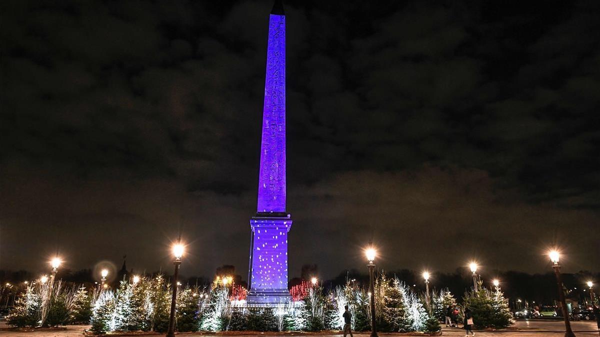 A picture taken on December 8  2020 shows a view of the illuminated obelisque at the Concorde square after the inauguration of the Christmas season lights in Paris  (Photo by STEPHANE DE SAKUTIN   AFP)