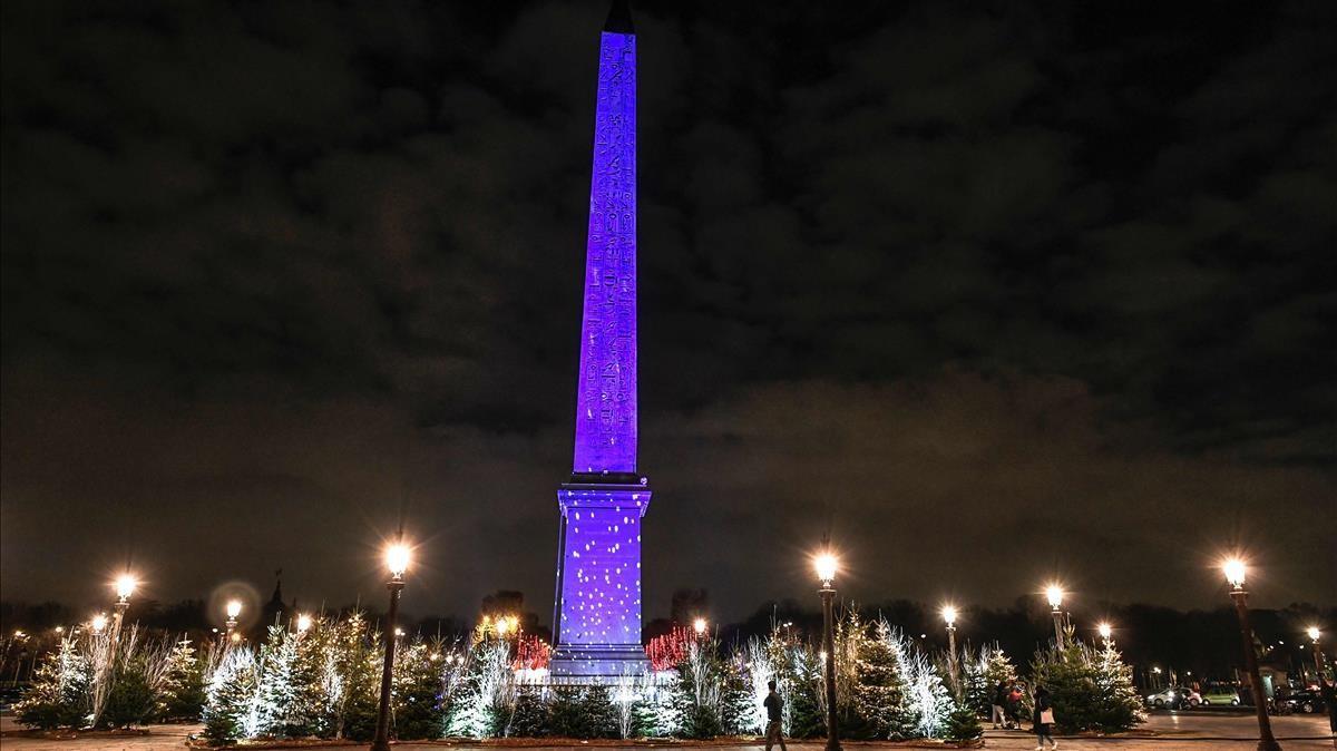A picture taken on December 8  2020 shows a view of the illuminated obelisque at the Concorde square after the inauguration of the Christmas season lights in Paris  (Photo by STEPHANE DE SAKUTIN   AFP)