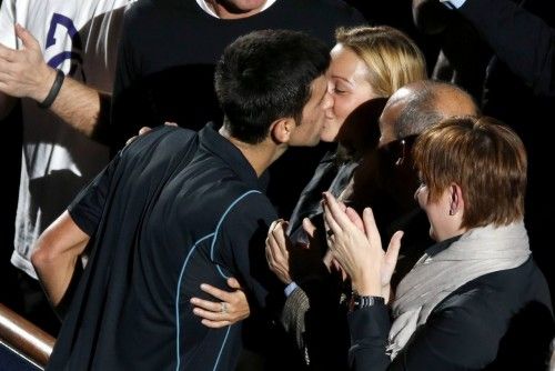 Djokovic kisses his fiancee Jelena Ristic after he defeated Ferrer in their final match at the Paris Masters men's singles tennis tournament in Paris