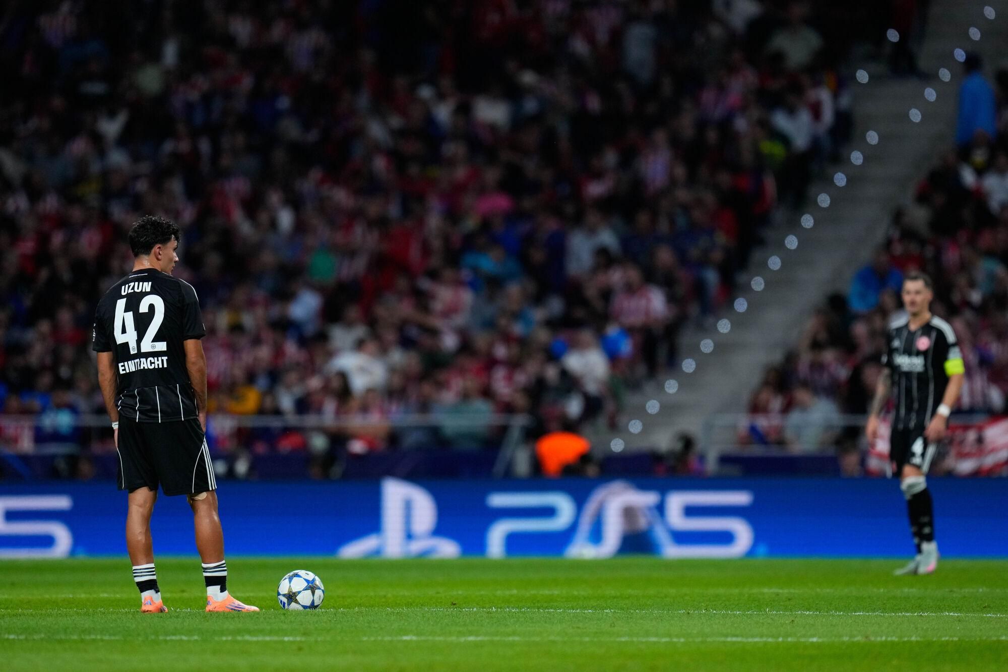 Frankfurt's Can Uzun reacts after Atletico Madrid's Robin Le Normand scored his side's second goal during the Champions League opening phase soccer match between Atletico Madrid and Eintracht Frankfurt at the Metropolitano stadium in Madrid, Spain, Tuesday, Sept. 30, 2025. (AP Photo/Manu Fernandez). Editorial use only / Only Italy and Spain
