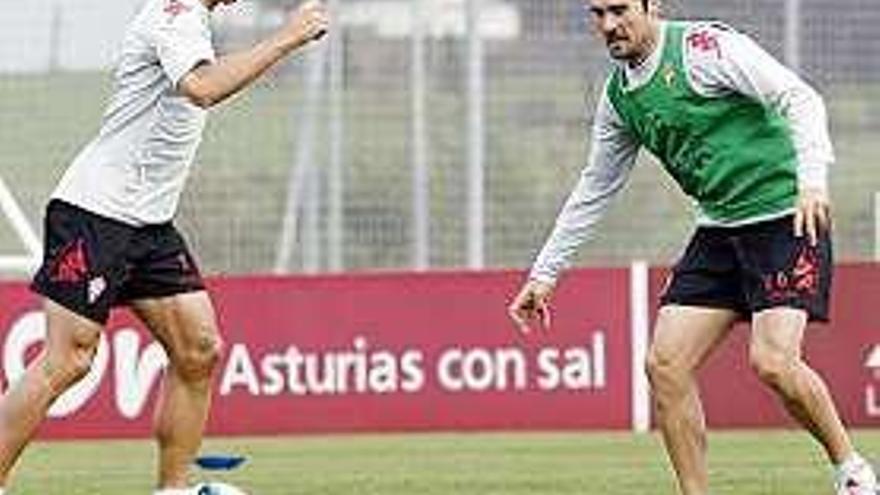 Casquero encara a López Garai en un entrenamiento.