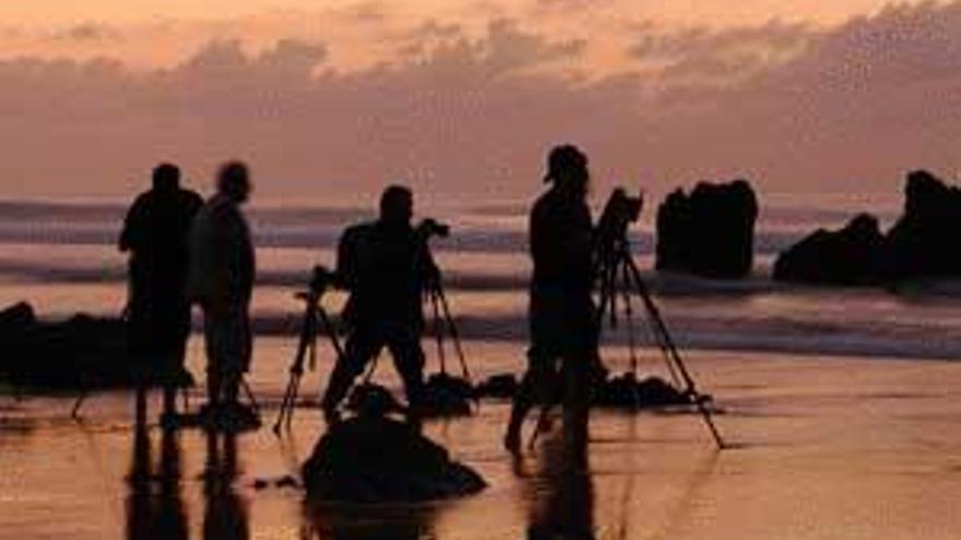 Fotógrafos en la costa