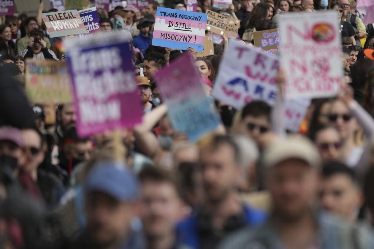Campaigners take part in a rally organised by trans rights groups, trade unions, and community organisations following the Supreme Court ruling on the definition of a woman in equalities law, at Parliament Square, central London, Saturday April 19, 2025. (AP Photo/Alastair Grant)