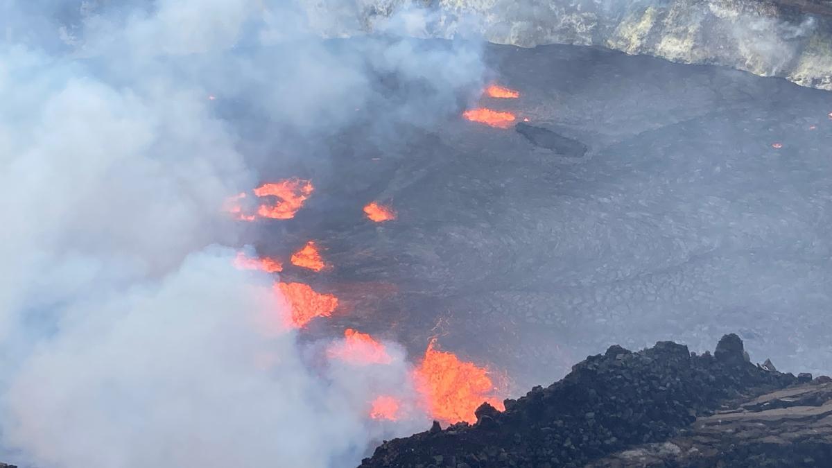 A rising lava lake is seen within Halema'uma'u crater during the eruption of Kilauea  volcano