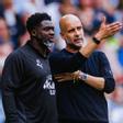 Kolo Touré, junto a Pep Guardiola