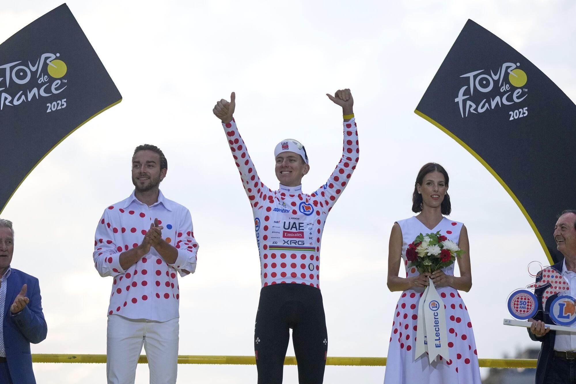Tour de France winner Tadej Pogacar of Slovenia also took the best climber's dotted jersey after the twenty-first stage of the Tour de France cycling race over 132.3 kilometers (82.1 miles) with start in Mantes-la-Ville and finish on the Champs-Elysees in Paris, France, Sunday, July 27, 2025. (AP Photo/Mosa'ab Elshamy)