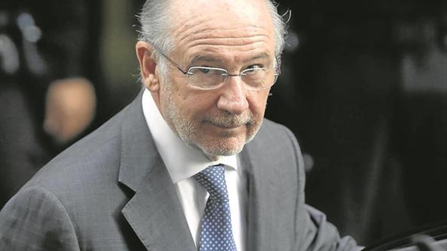 El juez sienta en el banquillo a Rato y a otros 31 acusados por Bankia