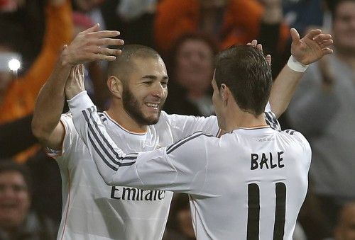 Real Madrid's Benzema celebrates his goal against Celta Vigo with teammate Bale during their Spanish First Division soccer match at Santiago Bernabeu stadium in Madrid
