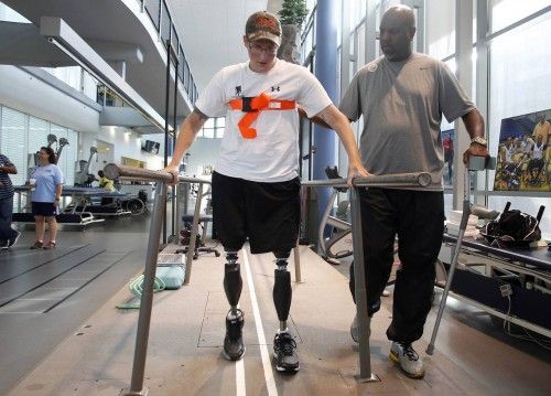 Sgt. Matt Krumwiede of the U.S. Army practices walking at Brooke Army Medical Center in San Antonio