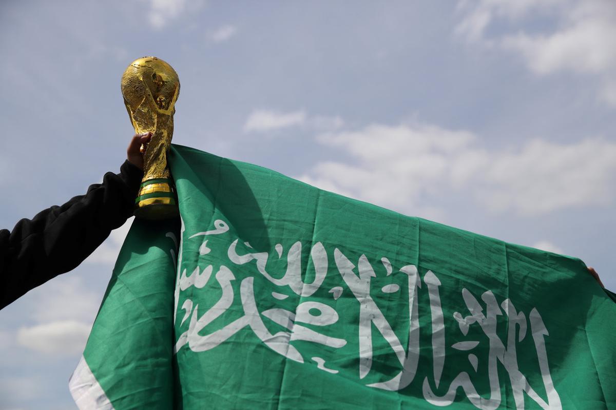 Soccer Football - World Cup - Group A - Russia vs Saudi Arabia - Luzhniki Stadium, Moscow, Russia - June 14, 2018 A Saudi Arabia fan holds a replica world cup outside the stadium before the match REUTERS/Carl Recine Soccer Football - World Cup - Group A - Russia vs Saudi Arabia - Luzhniki Stadium, Moscow, Russia - June 14, 2018 A Saudi Arabia fan holds a replica world cup outside the stadium before the match REUTERS/Carl Recine