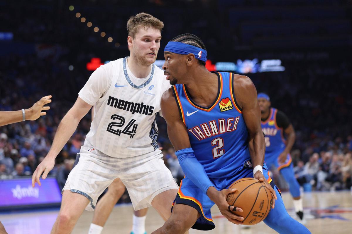 Oklahoma City Thunder guard Shai Gilgeous-Alexander (2) looks for an outlet against Memphis Grizzlies guard Cam Spencer (24) during the second half of an NBA basketball game Monday, Dec. 22, 2025, in Oklahoma City. (AP Photo/Nate Billings)