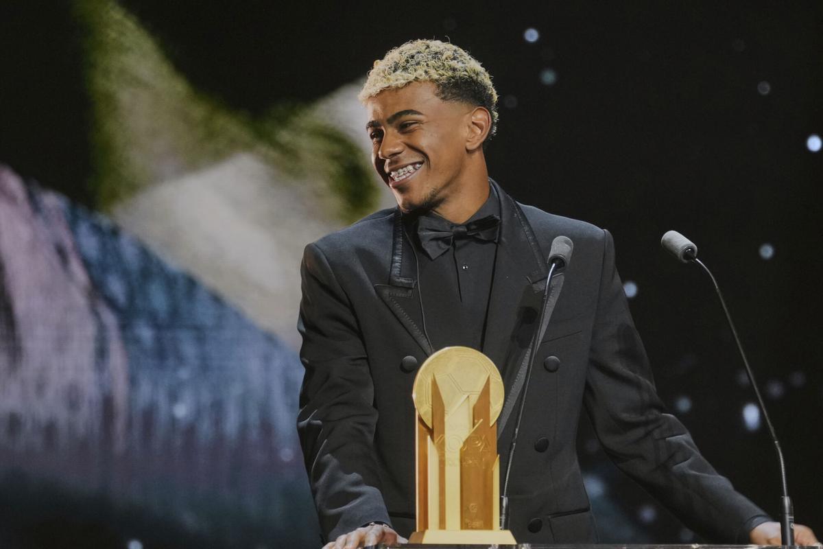 Barcelonas Spanish player Lamine Yamal receives the Kopa Trophy during the 69th Ballon dOr (Golden Ball) award ceremony at Theatre du Chatelet in Paris, Monday, Sept. 22, 2025. (AP Photo/Thibault Camus)