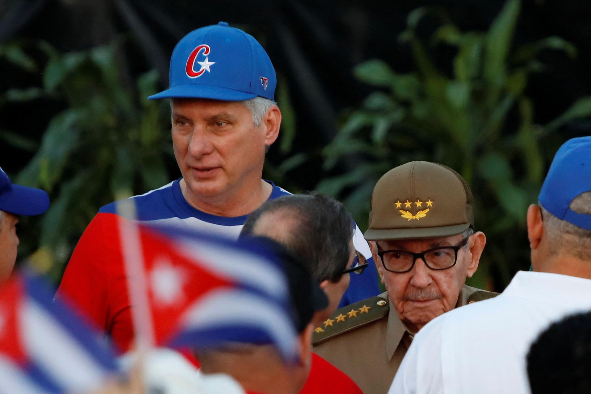 Raul Castro and Miguel Diaz-Canel watch an International Worker's Day celebration in Havana