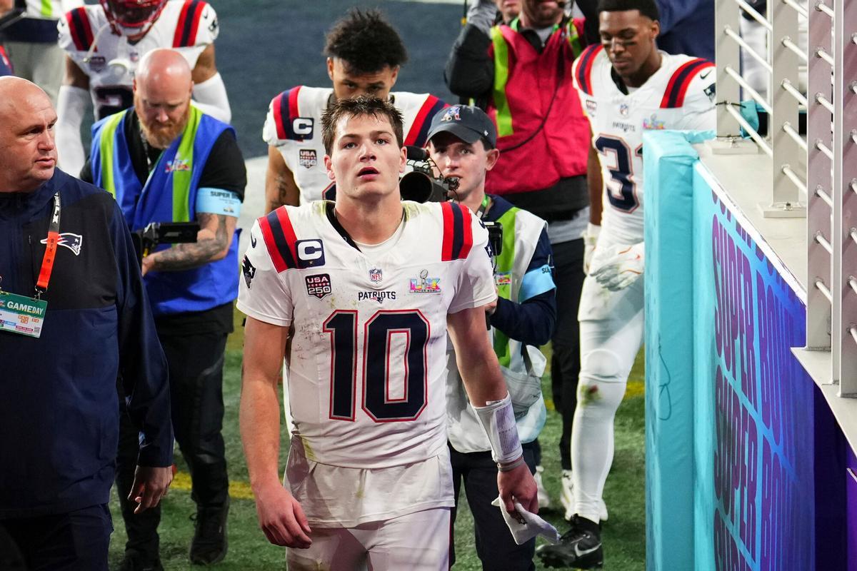 New England Patriots quarterback Drake Maye (10) and teammates walk off the field after losing to the Seattle Seahawks in the NFL Super Bowl 60 football game, Sunday, Feb. 8, 2026, in Santa Clara, Calif. (AP Photo/Godofredo A. Vásquez)