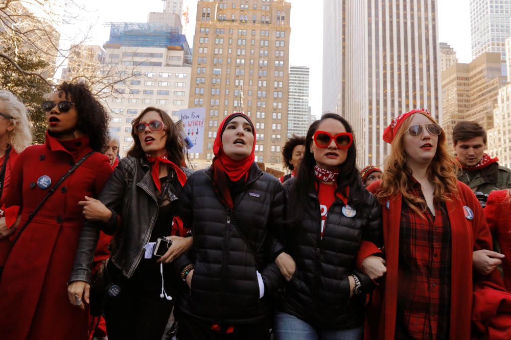 Organizers lead a march during a 'Day Without a ...