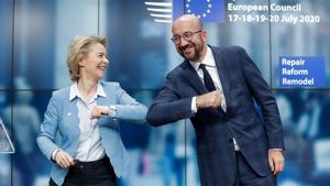 European Council President Charles Michel and European Commission President Ursula Von Der Leyen do an elbow bump at the end of a news conference following a four-day European summit at the European Council in Brussels, Belgium, July 21, 2020. Stephanie Lecocq/Pool via REUTERS