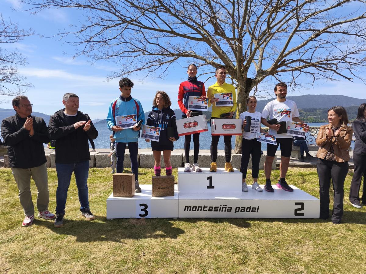 El podio con los ganadores en la categoría absoluta masculina y femenina.
