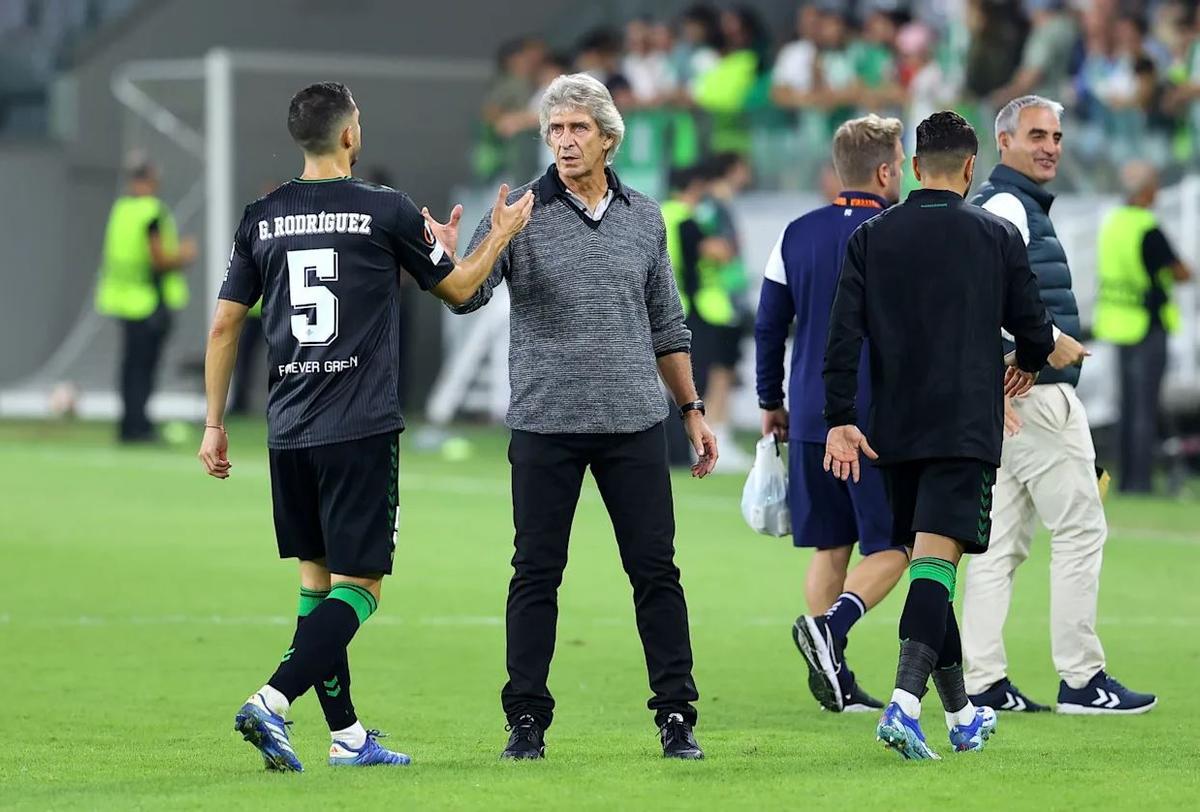 Guido Rodríguez junto a Pellegrini.