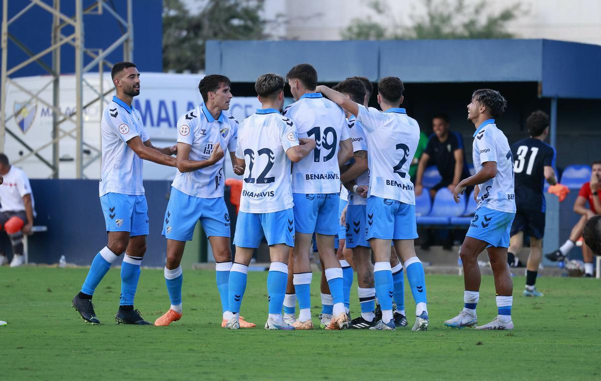 Los jugadores del Málaga CF celebran un gol durante la pretemporada.
