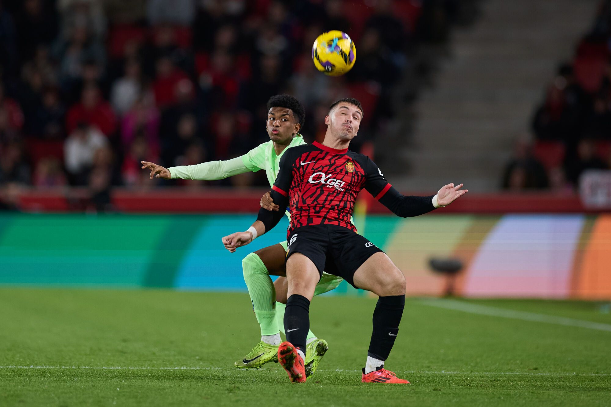 Alejandro Balde of FC Barcelona competes for the ball with Valery Fernandez of RCD Mallorca during the LaLiga EA Sports match between RCD Mallorca and FC Barcelona at Son Moix on December 3, 2024, in Palma, Spain. AFP7 03/12/2024 ONLY FOR USE IN SPAIN. Ricardo Larreina / AFP7 / Europa Press;2024;SOCCER;SPAIN;SPORT;ZSOCCER;ZSPORT;RCD Mallorca v FC Barcelona - LaLiga EA Sports;