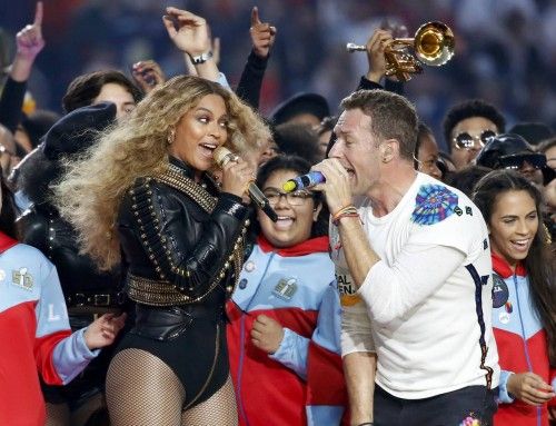 Beyonce and Chris Martin of Coldplay perform during half-time at the NFL's Super Bowl 50 football game between the Carolina Panthers and the Denver Broncos in Santa Clara