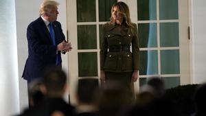 President Donald Trump joins first lady Melania Trump on stage after her speech to the 2020 Republican National Convention from the Rose Garden of the White House, Tuesday, Aug. 25, 2020, in Washington. (AP Photo/Evan Vucci)
